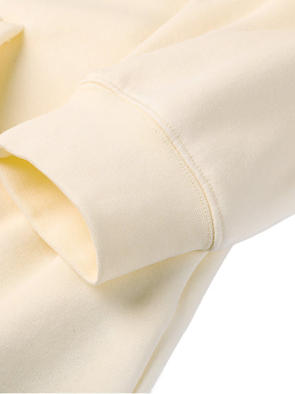 Close-up of a beige fabric with a subtle pattern on a white background