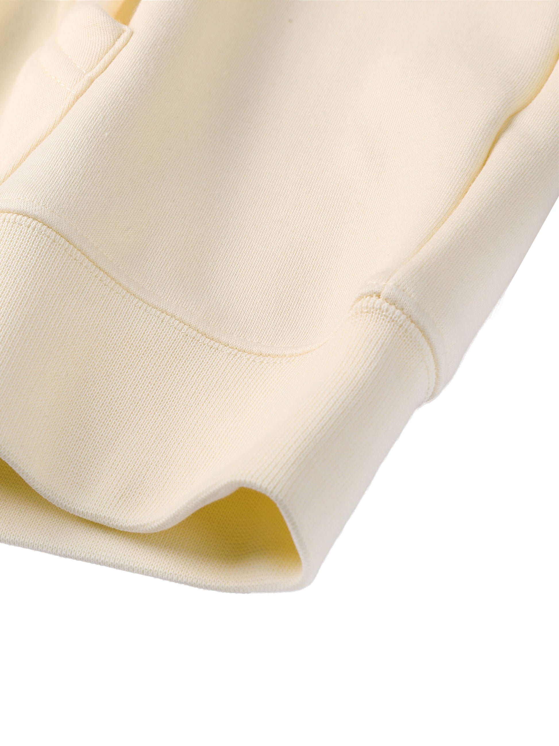 Close-up of a beige hoodie with a white background