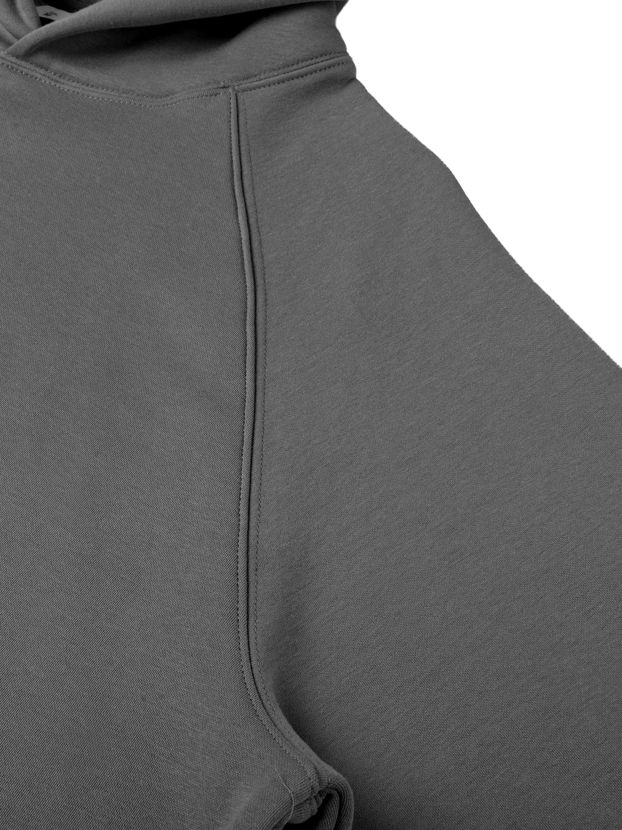 Close-up of a gray hoodie with a hood on a white background