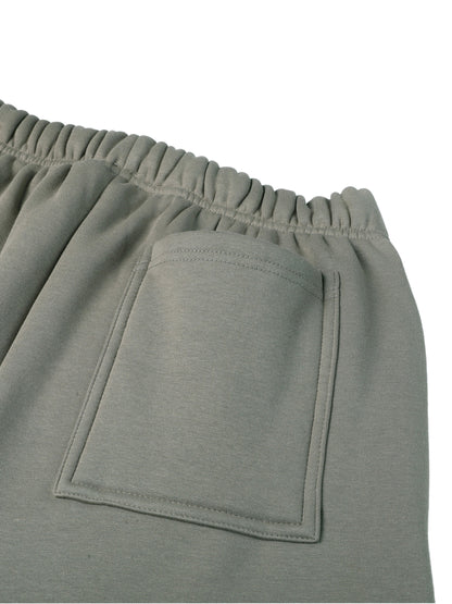Close-up of a gray sweatshirt with a pocket on a white background