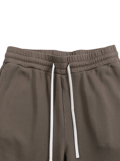 VERON Brown sweatpants with a white drawstring on a white background
