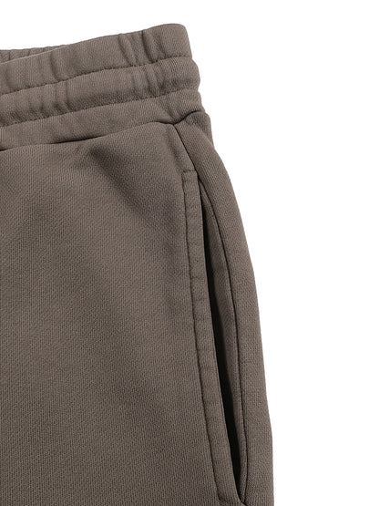 VERON Close-up of brown sweatpants on a white background