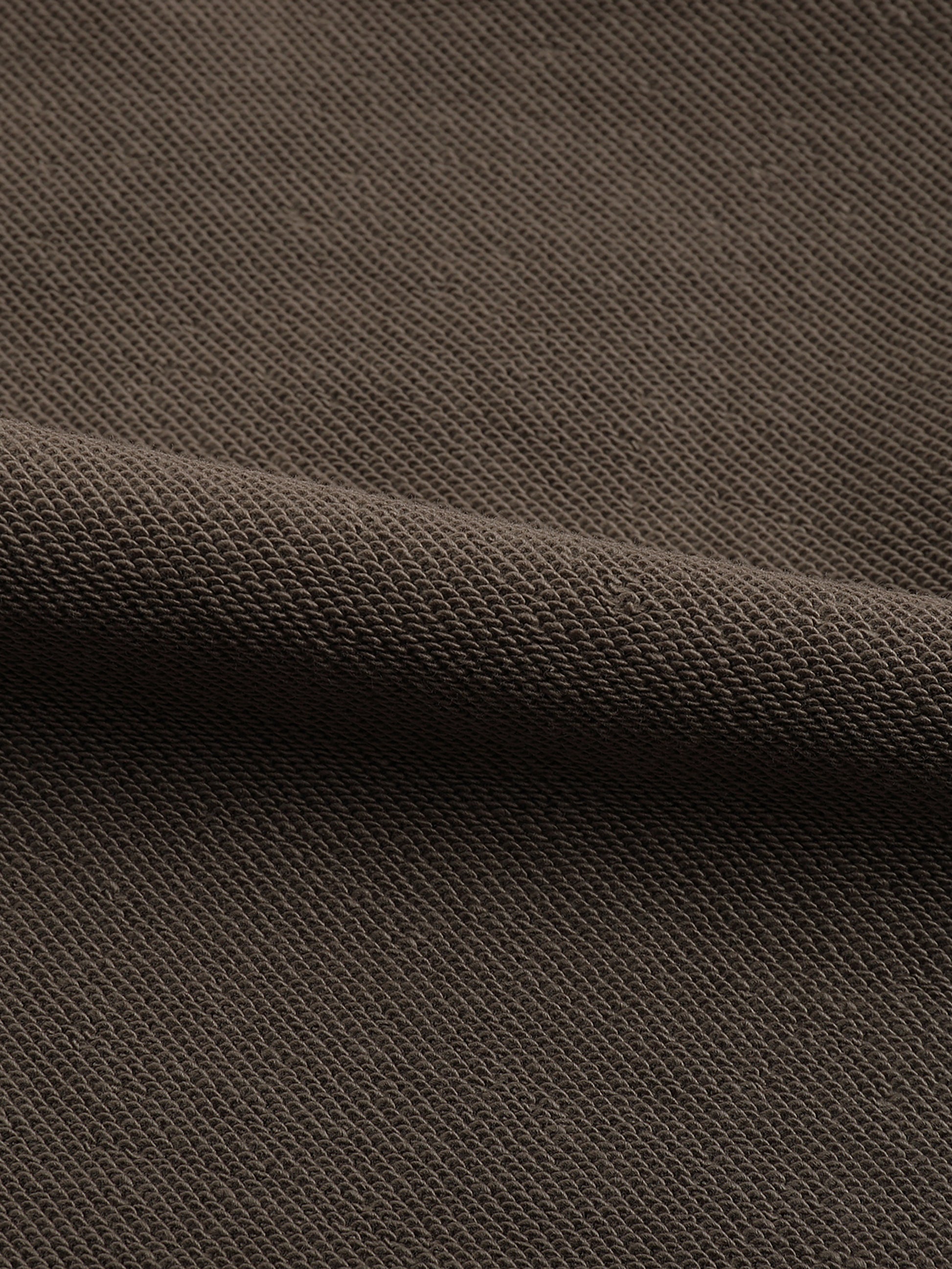 VERON Close-up of brown textured fabric