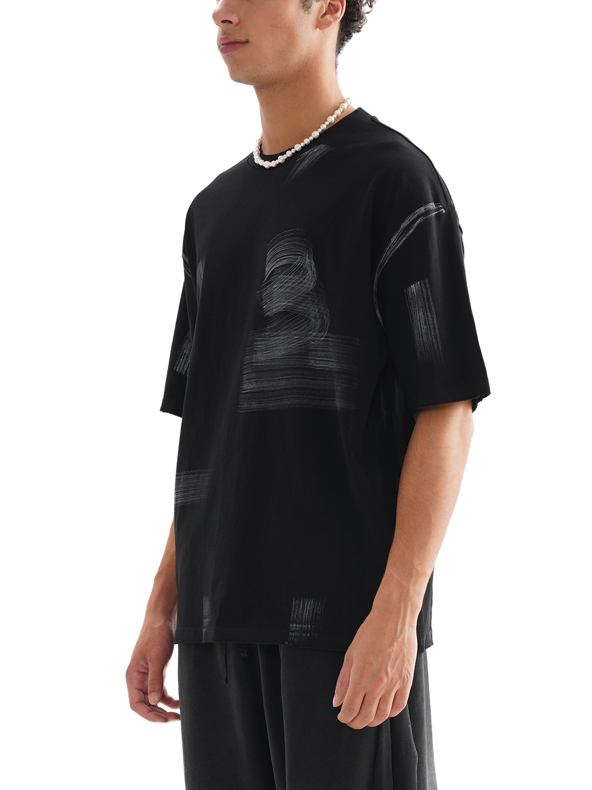 Model wearing VÉRON Le Prince Noir black streetwear tee 2