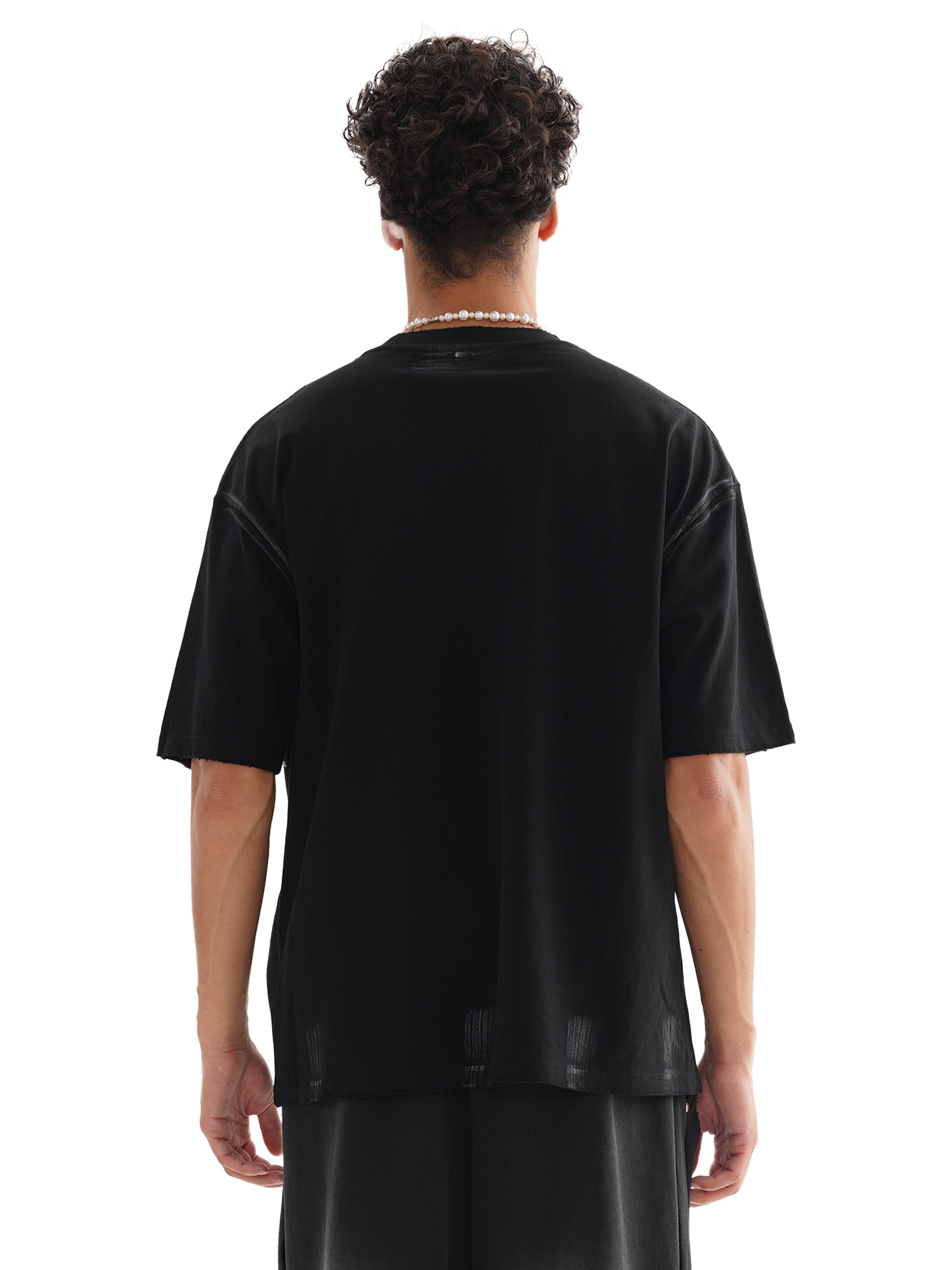 Model wearing VÉRON Le Prince Noir black streetwear tee 3