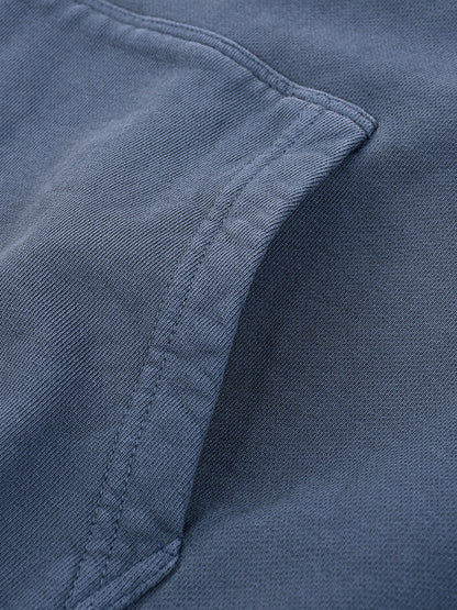 Close-up of a blue fabric texture with stitching detail