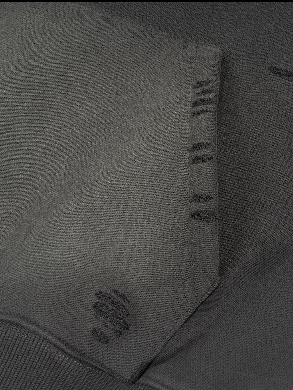 Close-up of a gray fabric with stitching details