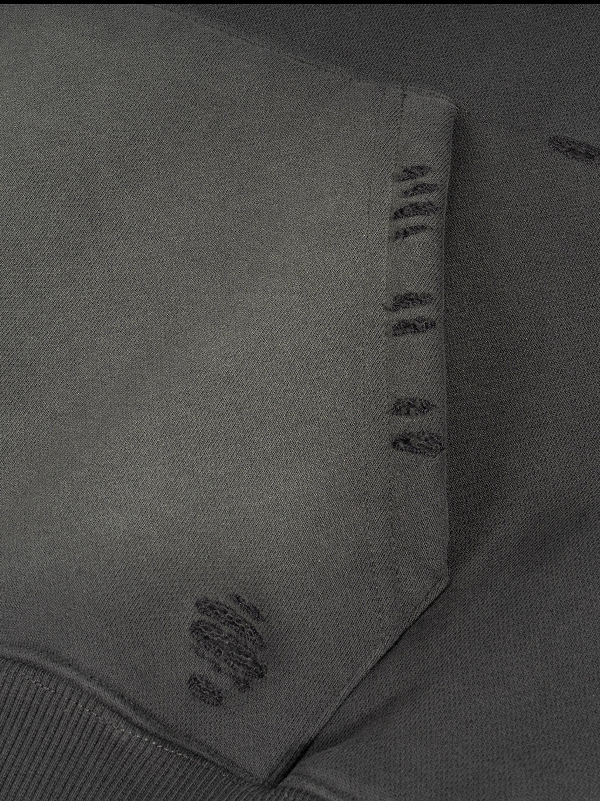 Close-up of a gray fabric with stitching details