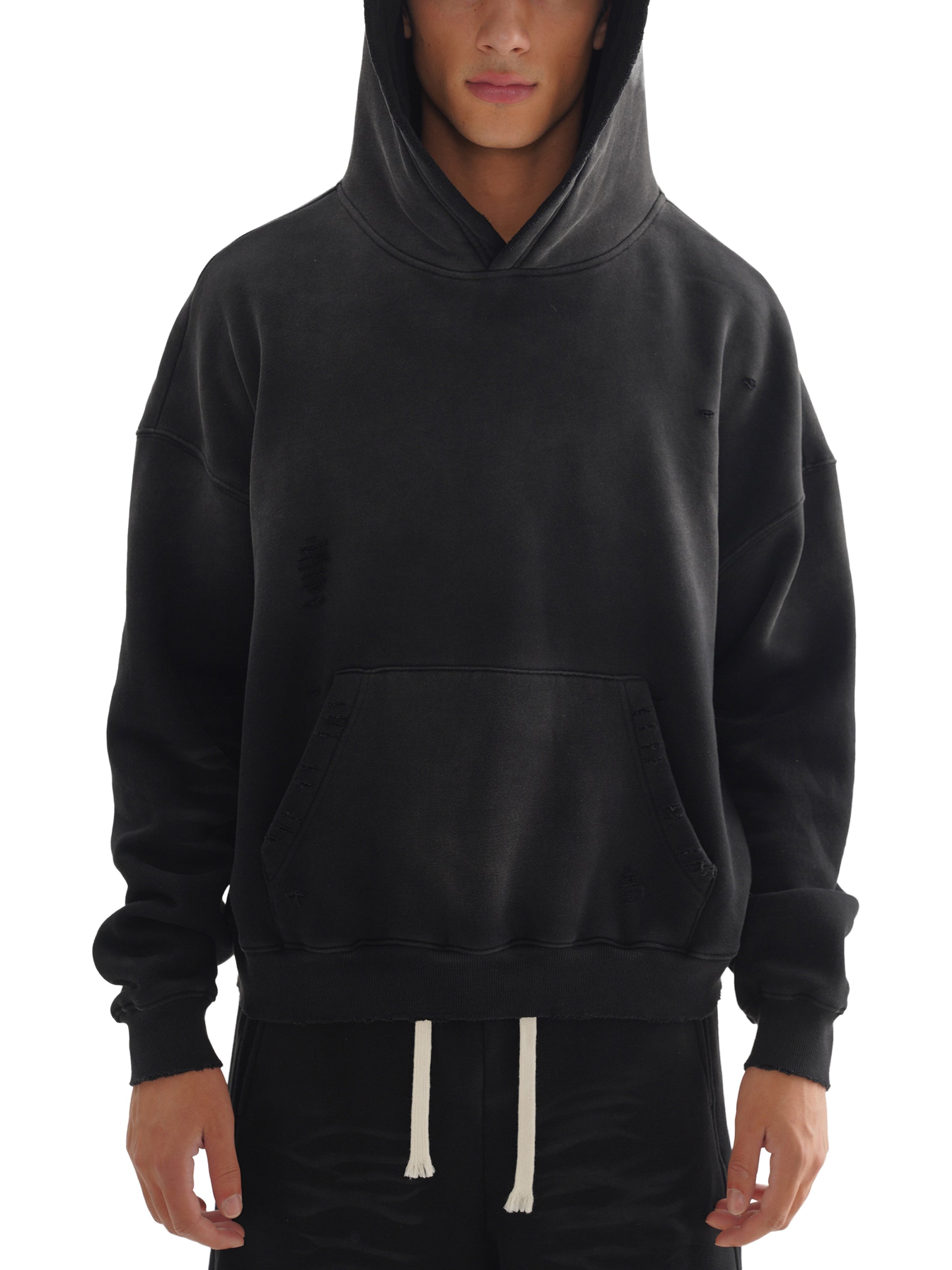 Black hoodie worn by a person on a white background