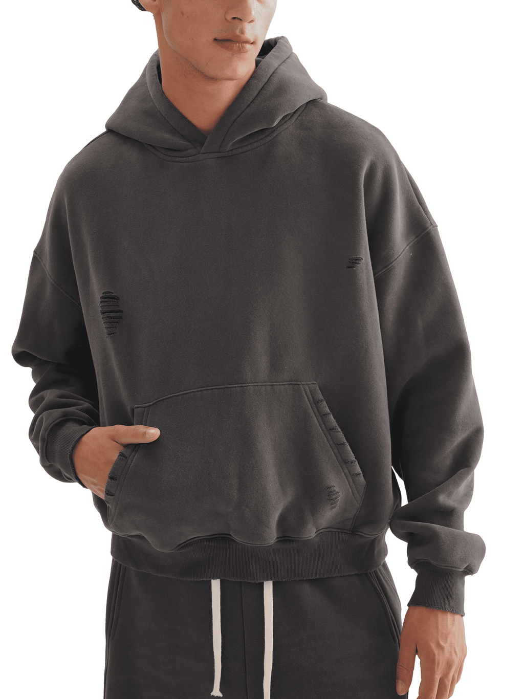 Person wearing a gray hoodie on a white background
