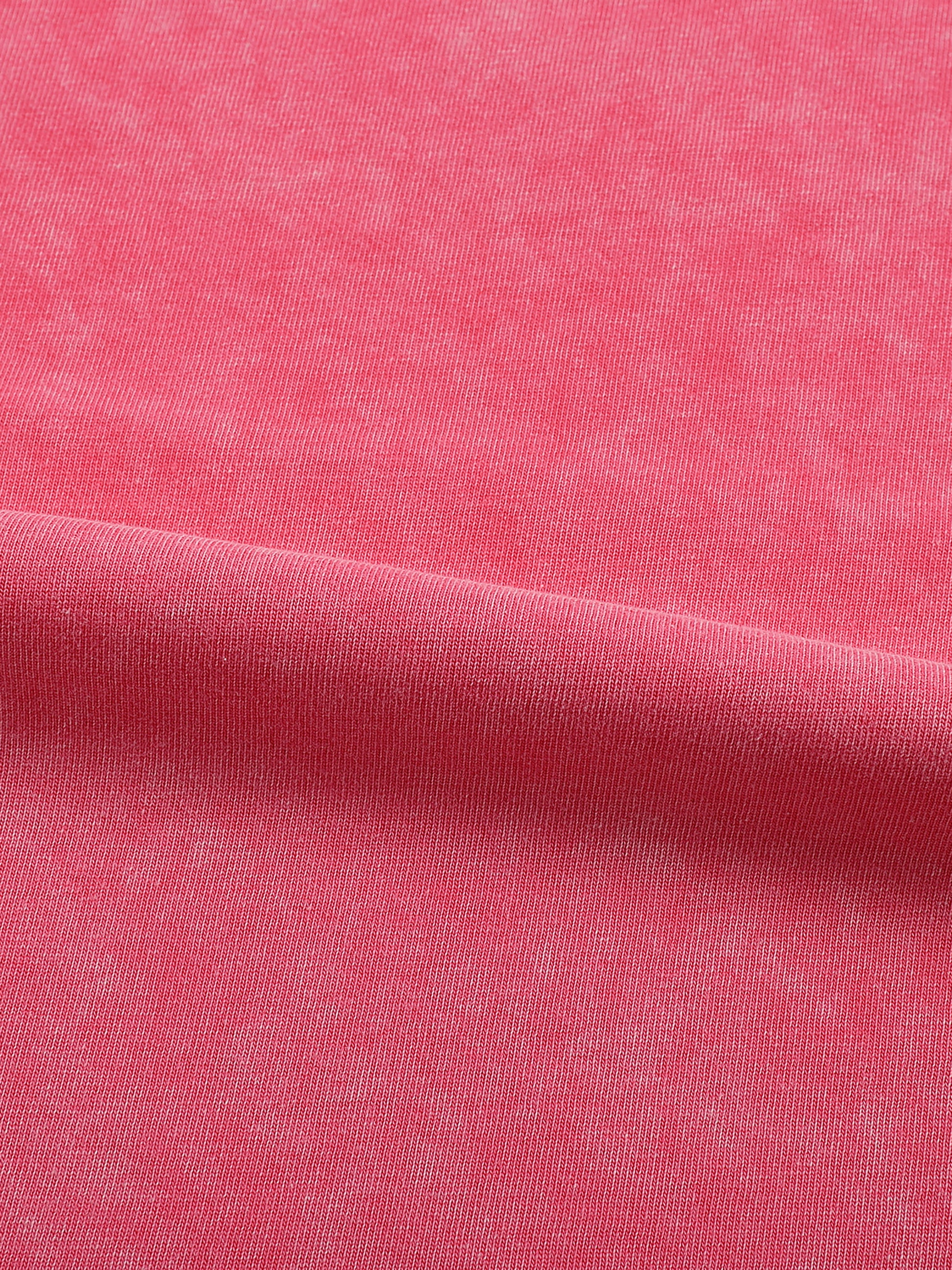 Close-up of pink fabric with a subtle texture