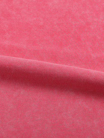 Close-up of pink fabric with a subtle texture