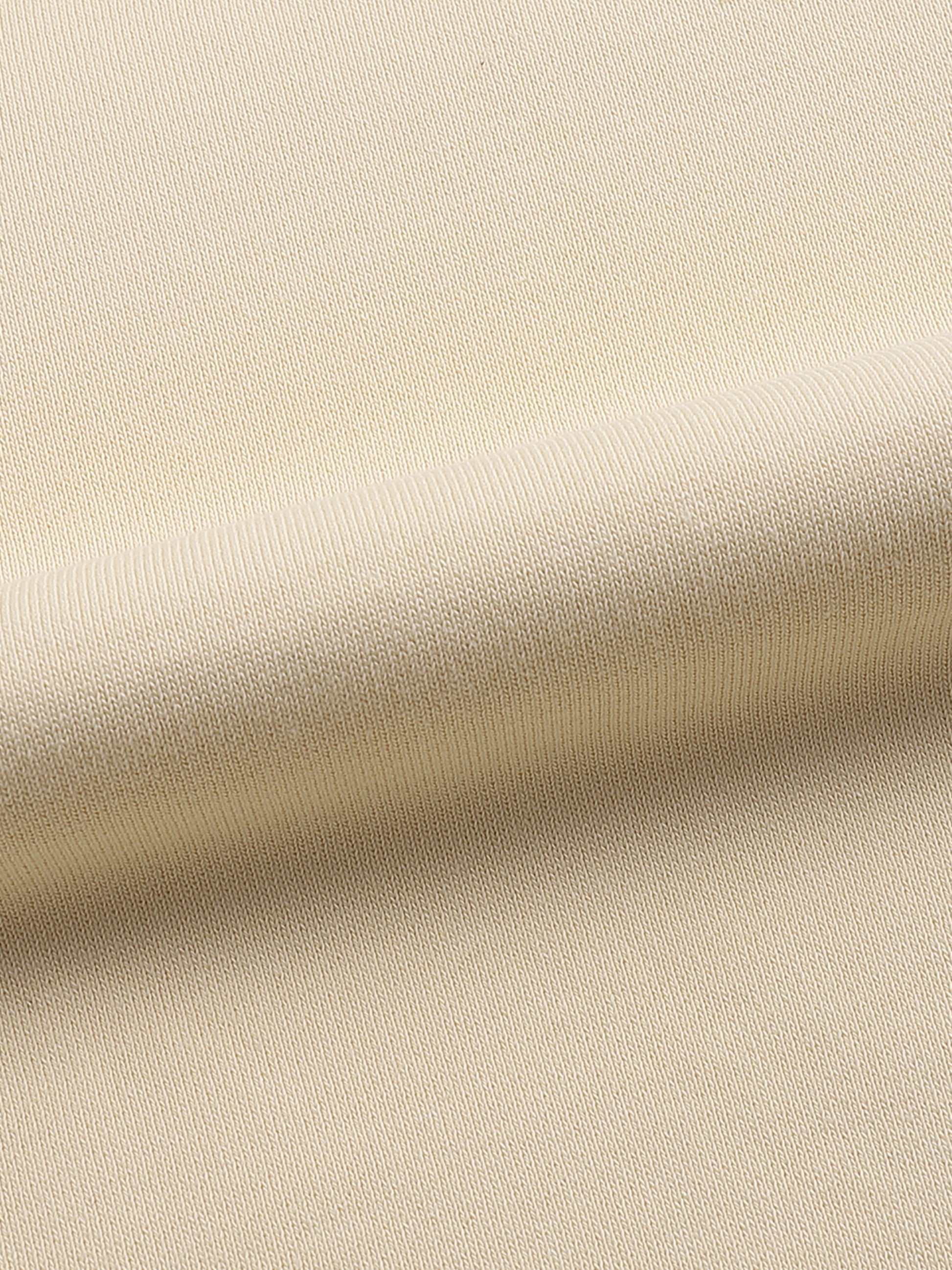 Close-up of beige fabric texture