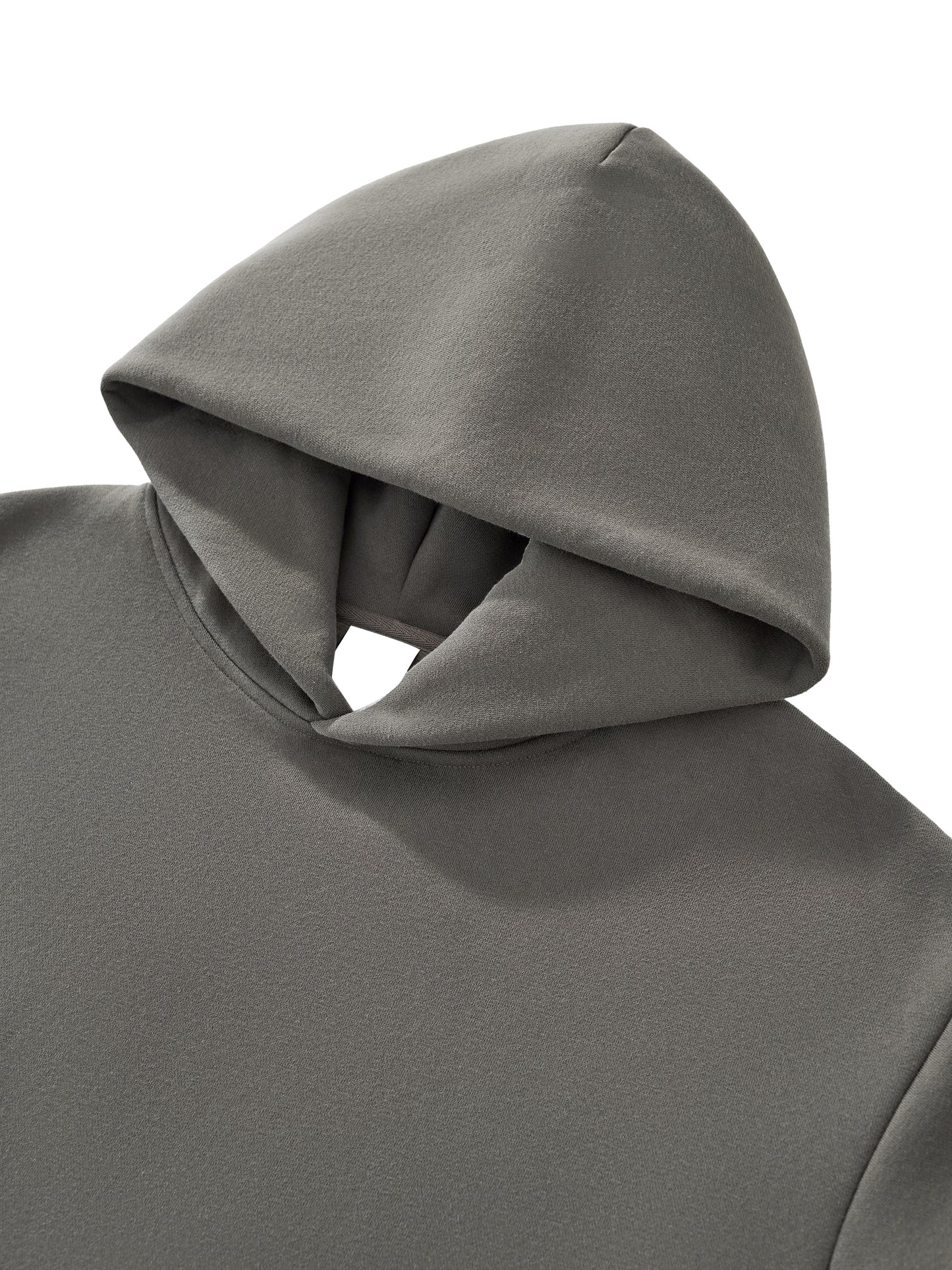 Close-up of thick cotton fabric texture on VÉRON hoodie. 


