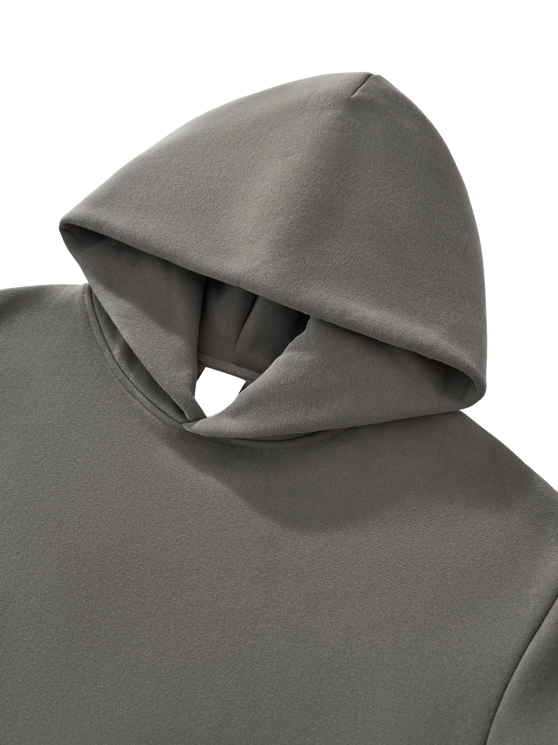 Close-up of thick cotton fabric texture on VÉRON hoodie. 

