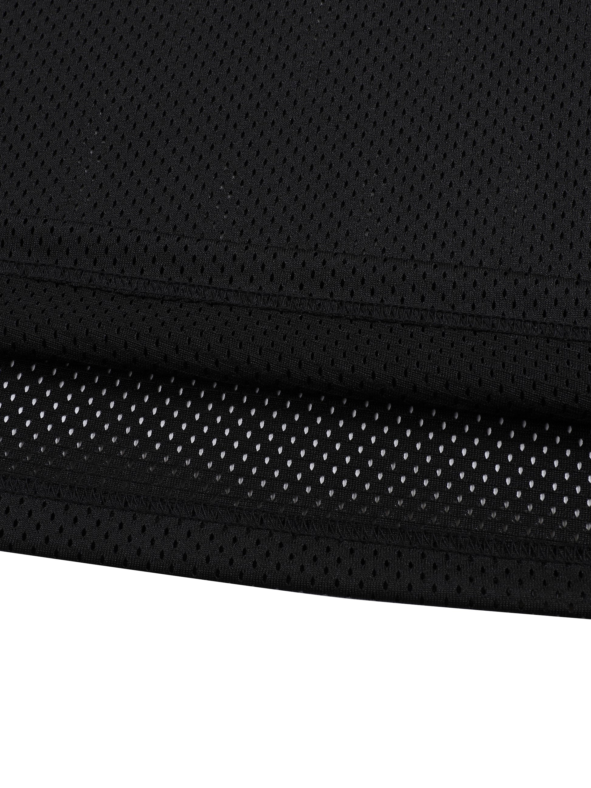 Close-up of black fabric with a textured pattern on a white background