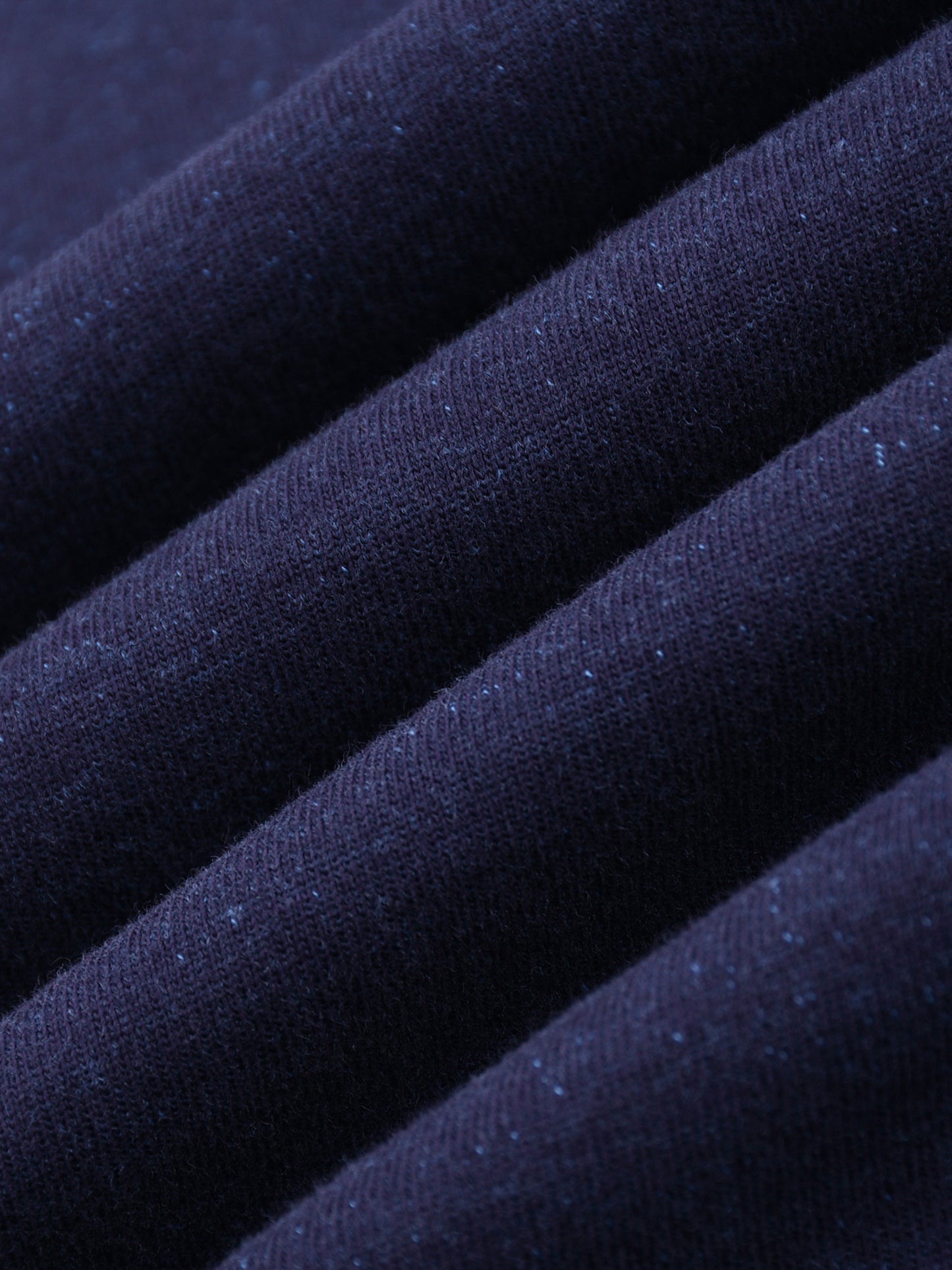 Close-up of dark blue fabric with a textured surface