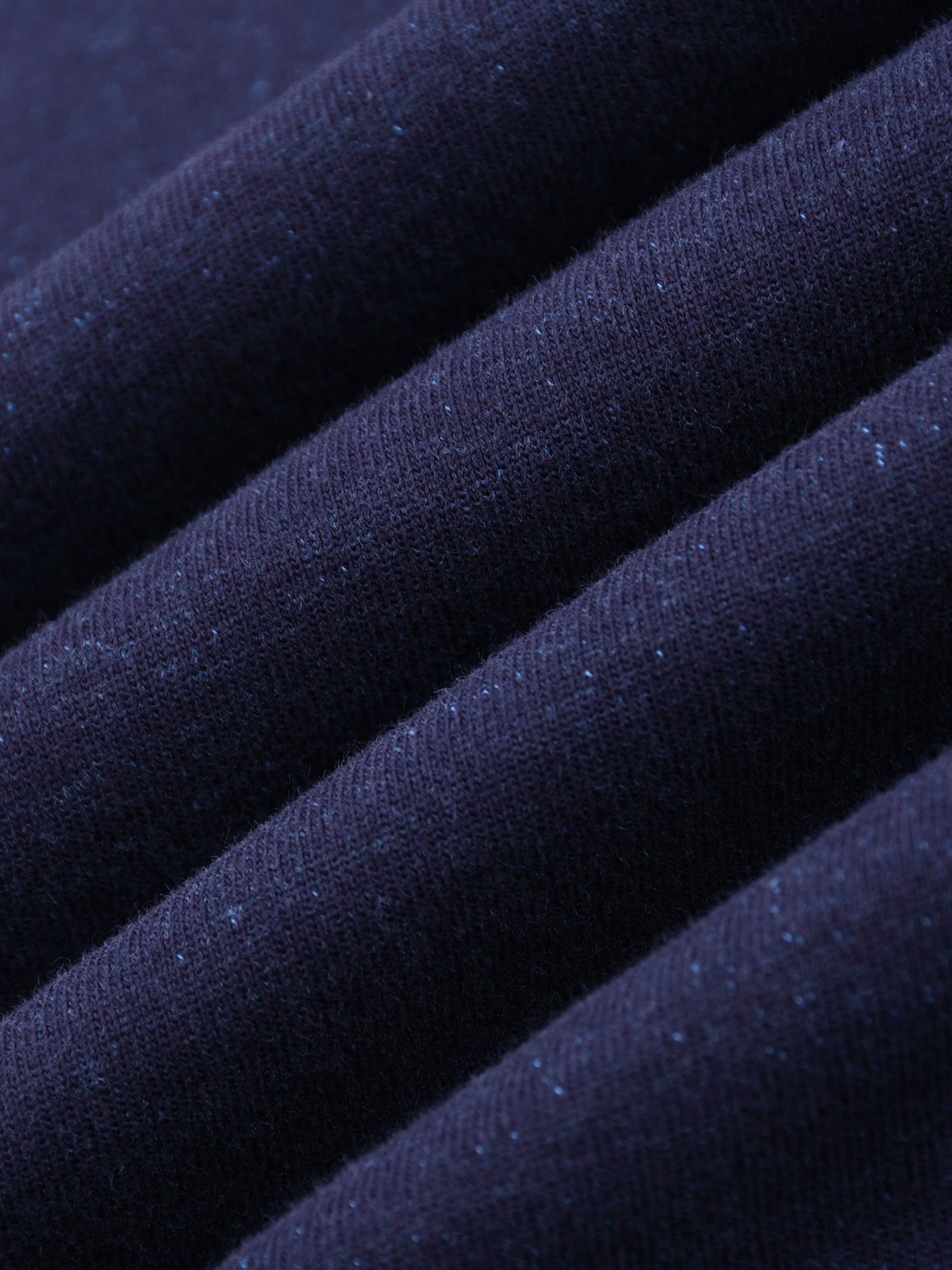 Close-up of dark blue fabric with a textured surface