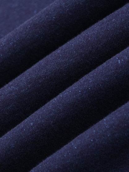 Close-up of dark blue fabric with a textured surface