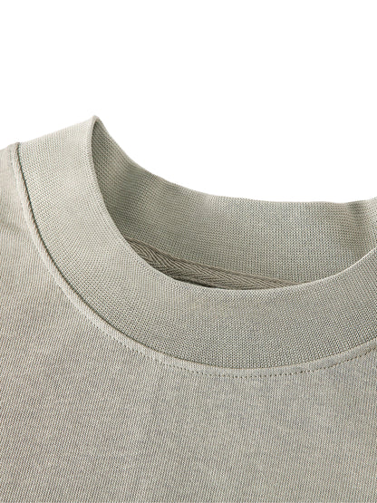 Flat lay of VÉRON Paris Est Magique shirt with accessories. 


