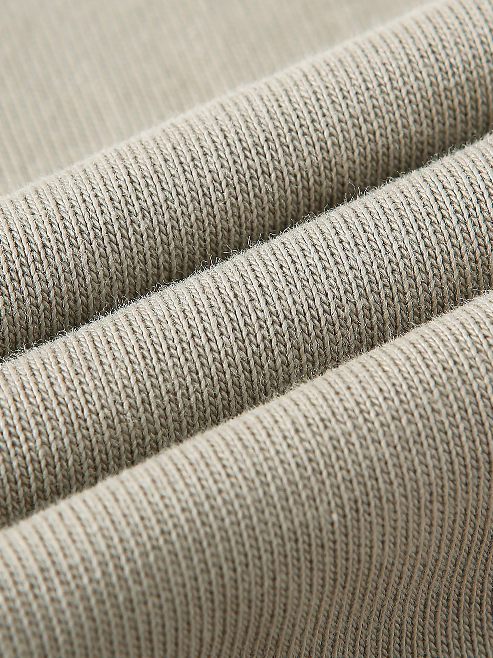 Close-up of beige fabric with a ribbed texture