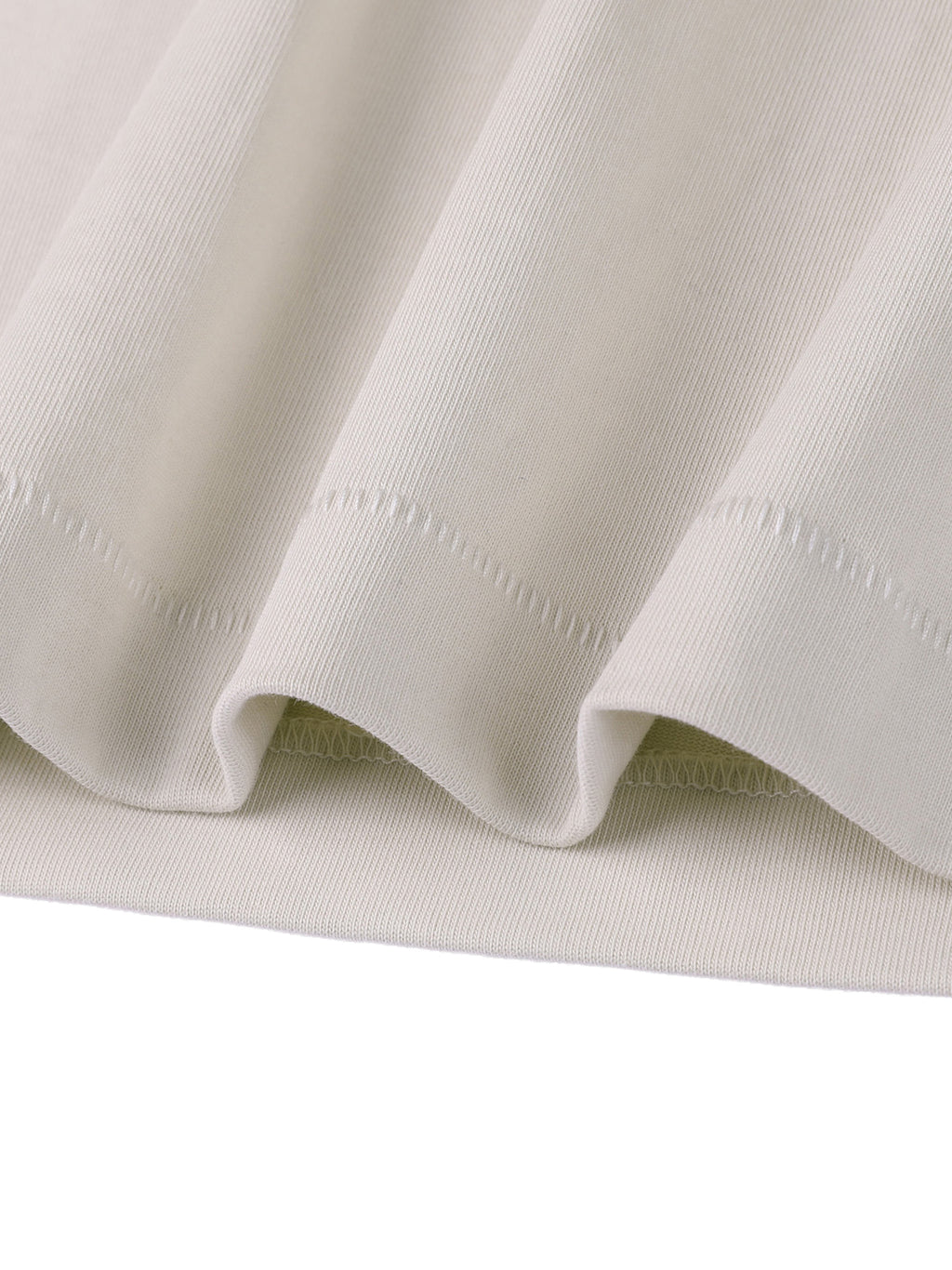 Close-up of light gray fabric with visible stitching on a white background