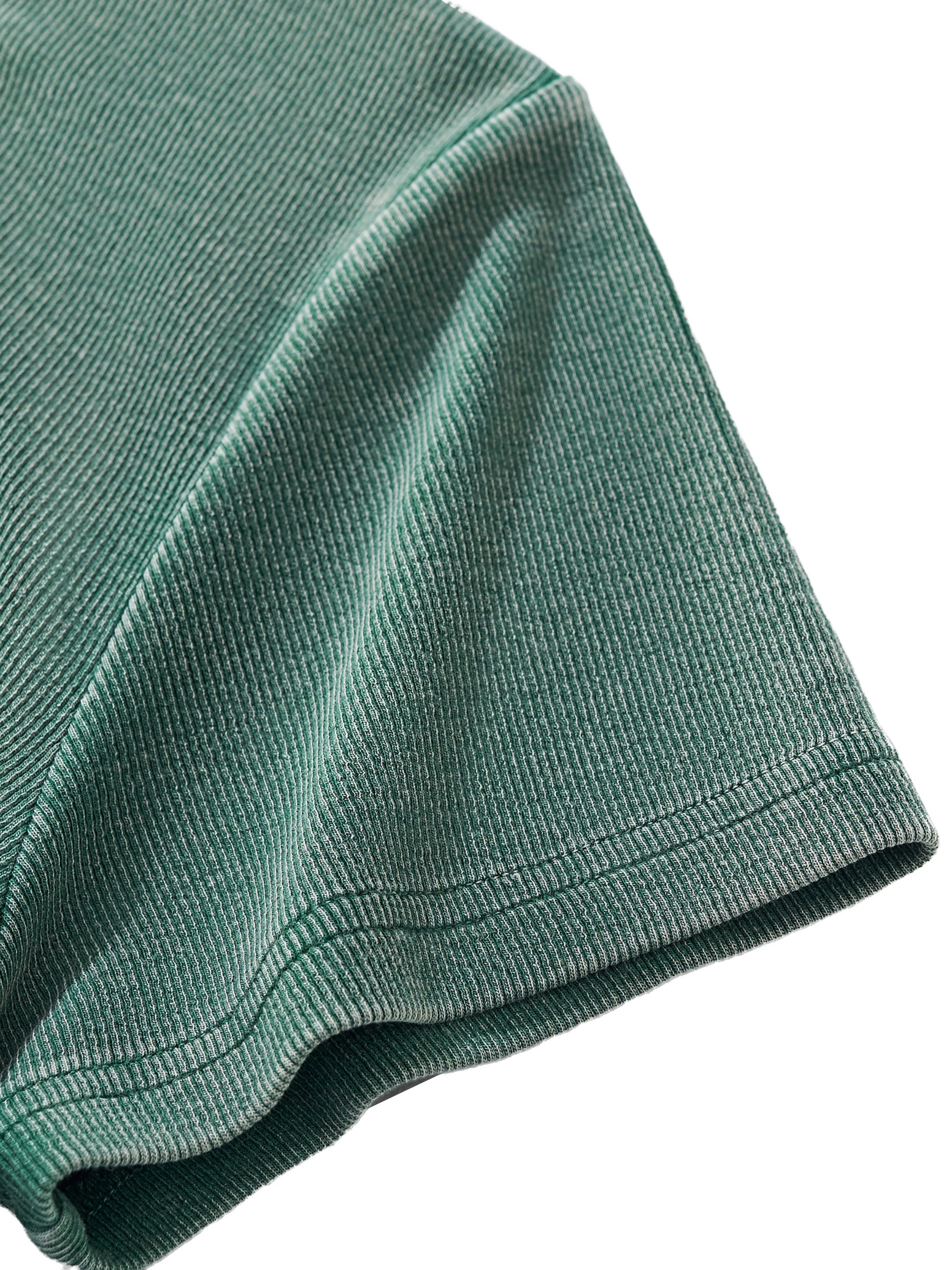 Close-up of thick vintage-wash fabric texture of VÉRON women's tee. 

