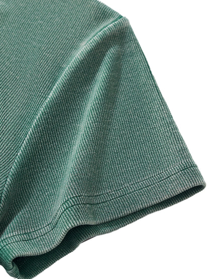 Close-up of thick vintage-wash fabric texture of VÉRON women's tee. 

