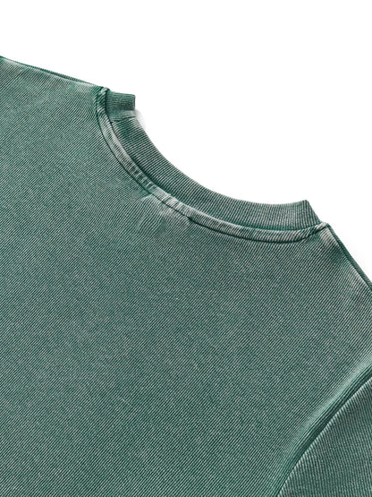 Close-up of thick vintage-wash fabric texture of VÉRON women's tee. 

