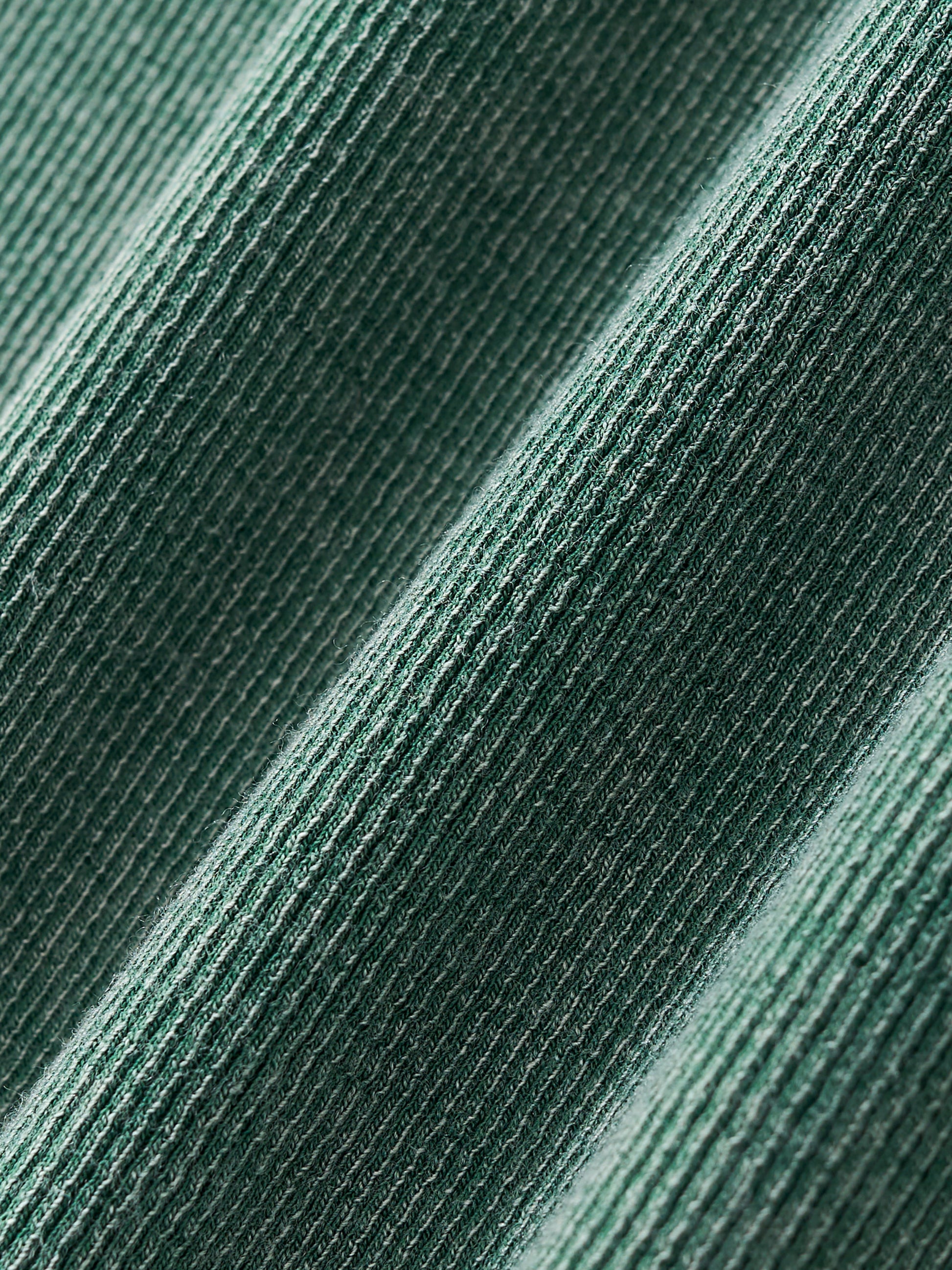 Close-up of thick vintage-wash fabric texture of VÉRON women's tee 5. 

