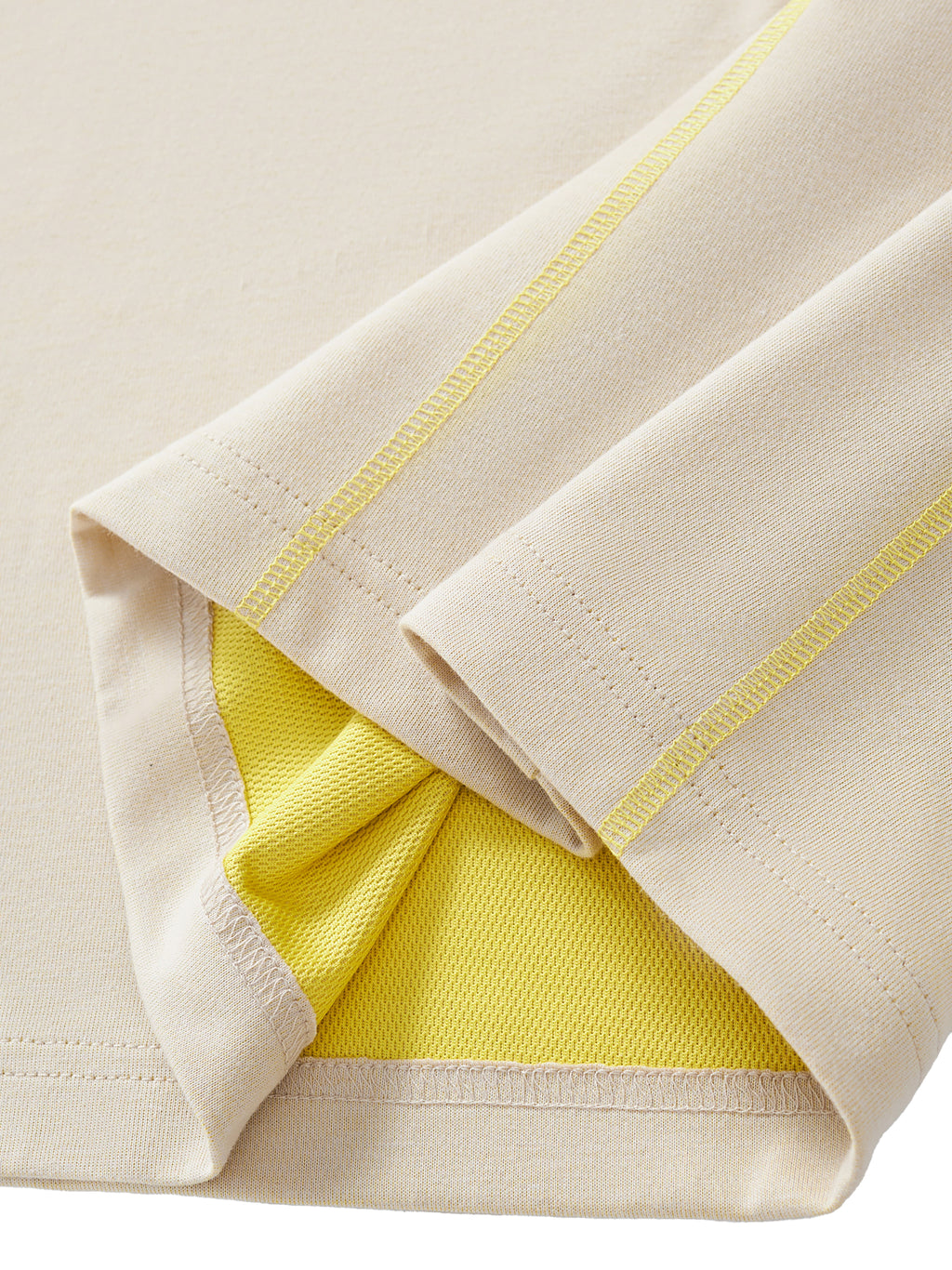 Close-up of a folded fabric with yellow interior and beige exterior