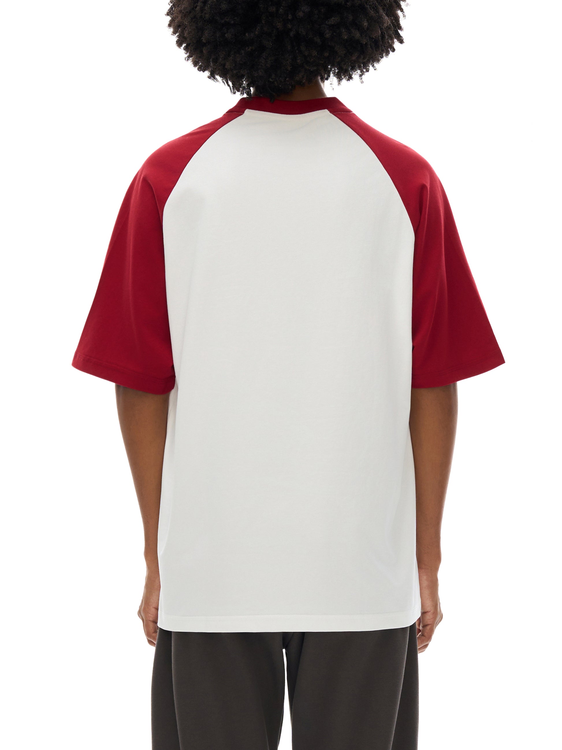 Model wearing VÉRON Le Cavalier unisex T-shirt in streetwear outfit 2