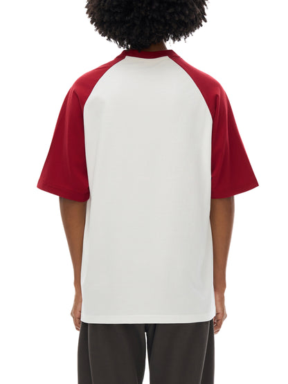 Model wearing VÉRON Le Cavalier unisex T-shirt in streetwear outfit 2