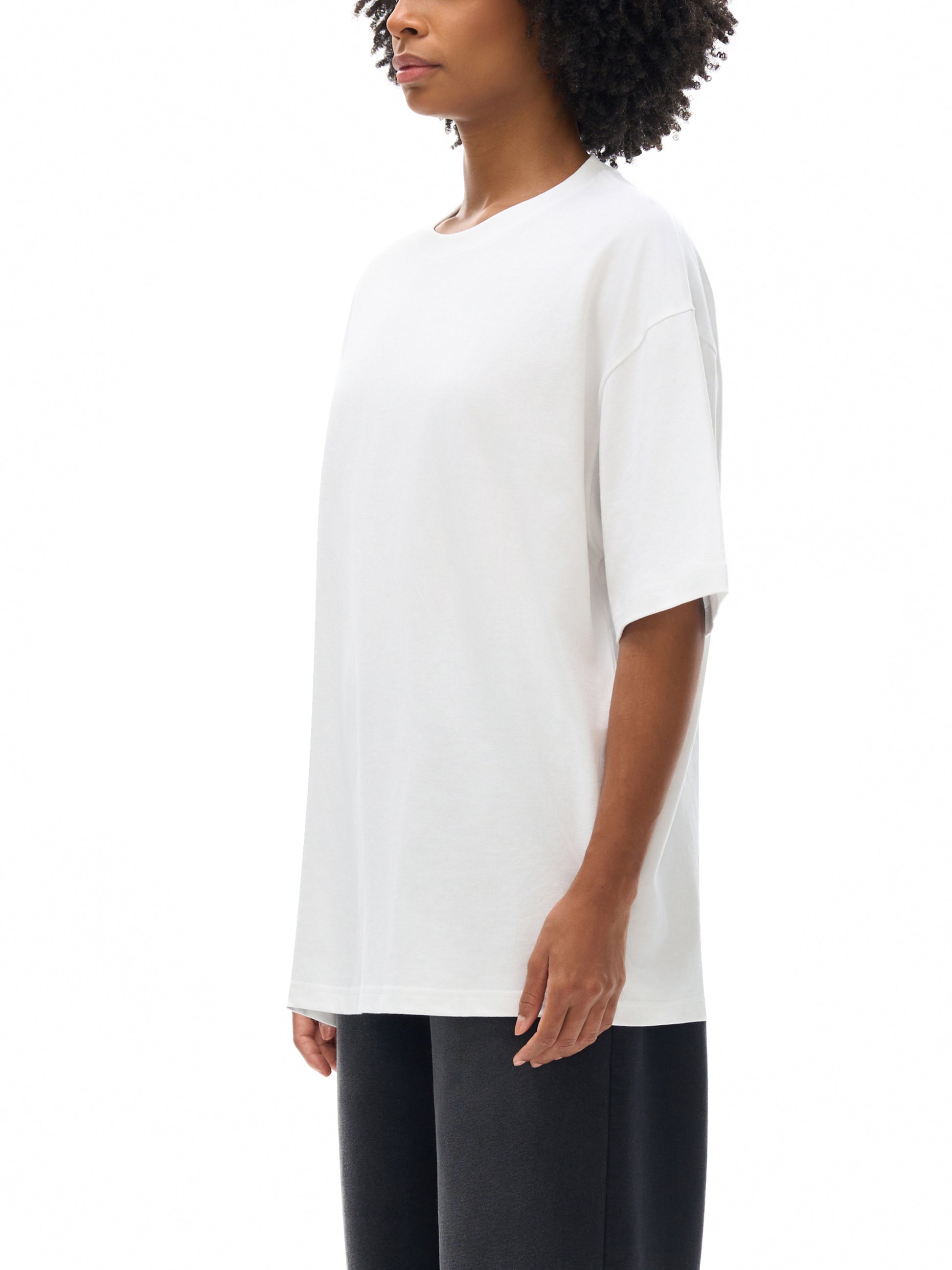 Female model styling VÉRON Portes de Lumière unisex graphic tee 3