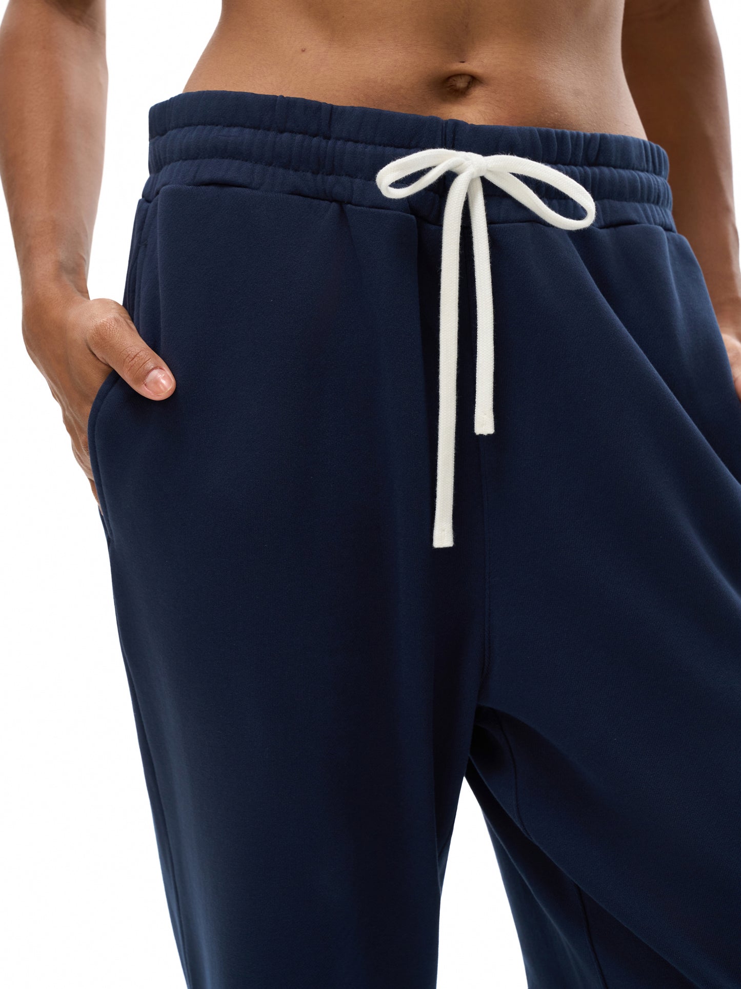 VERON Navy blue jogger pants with a white drawstring on Model