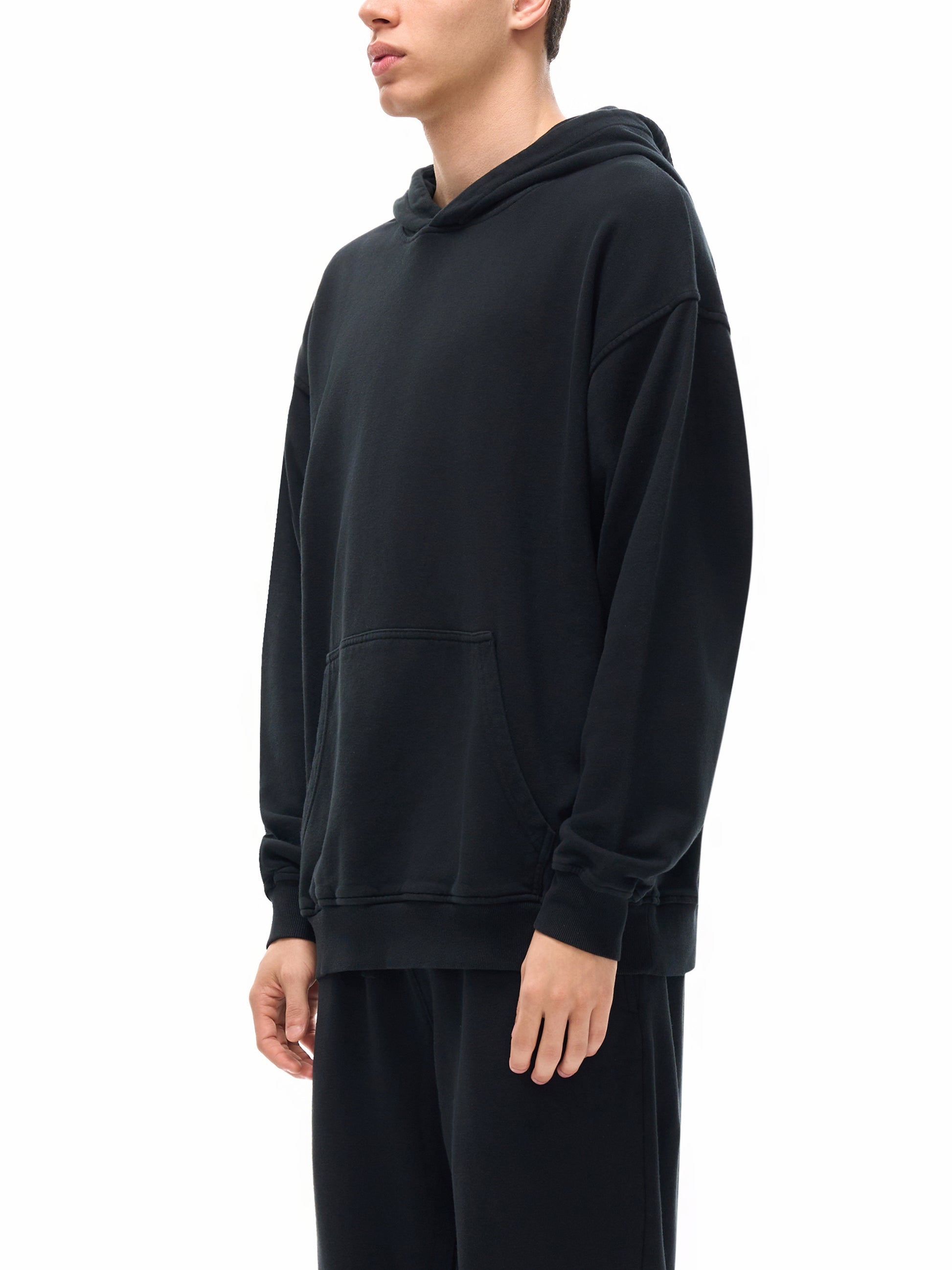 Male model wearing VÉRON oversized unisex hoodie  3