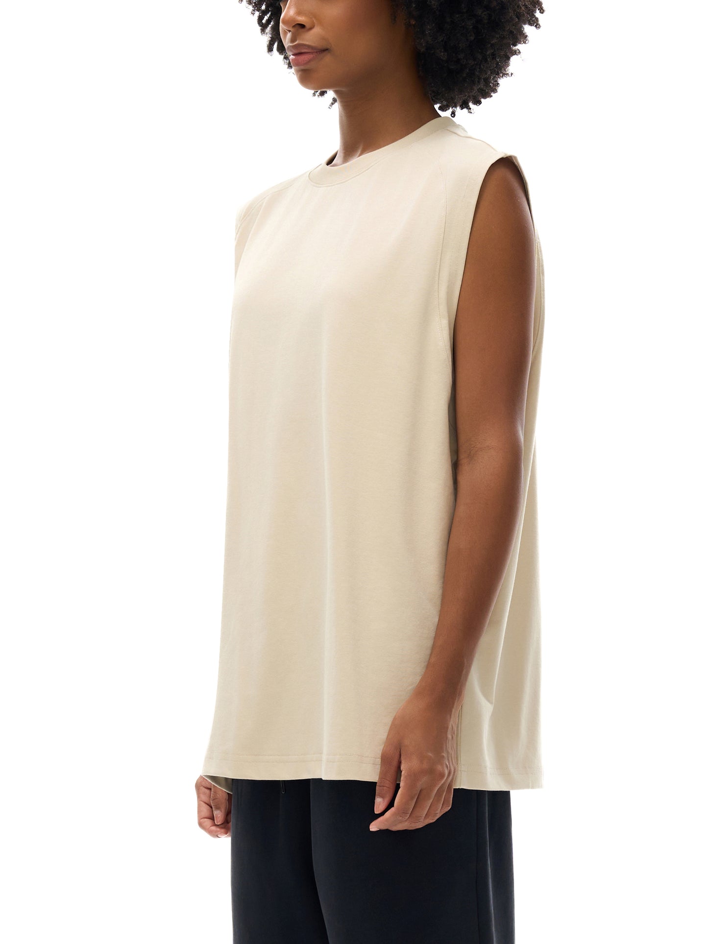 Model wearing VÉRON Élixir Cristal premium unisex tank in urban style 2