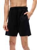 VERON Black shorts worn by a person on a white background