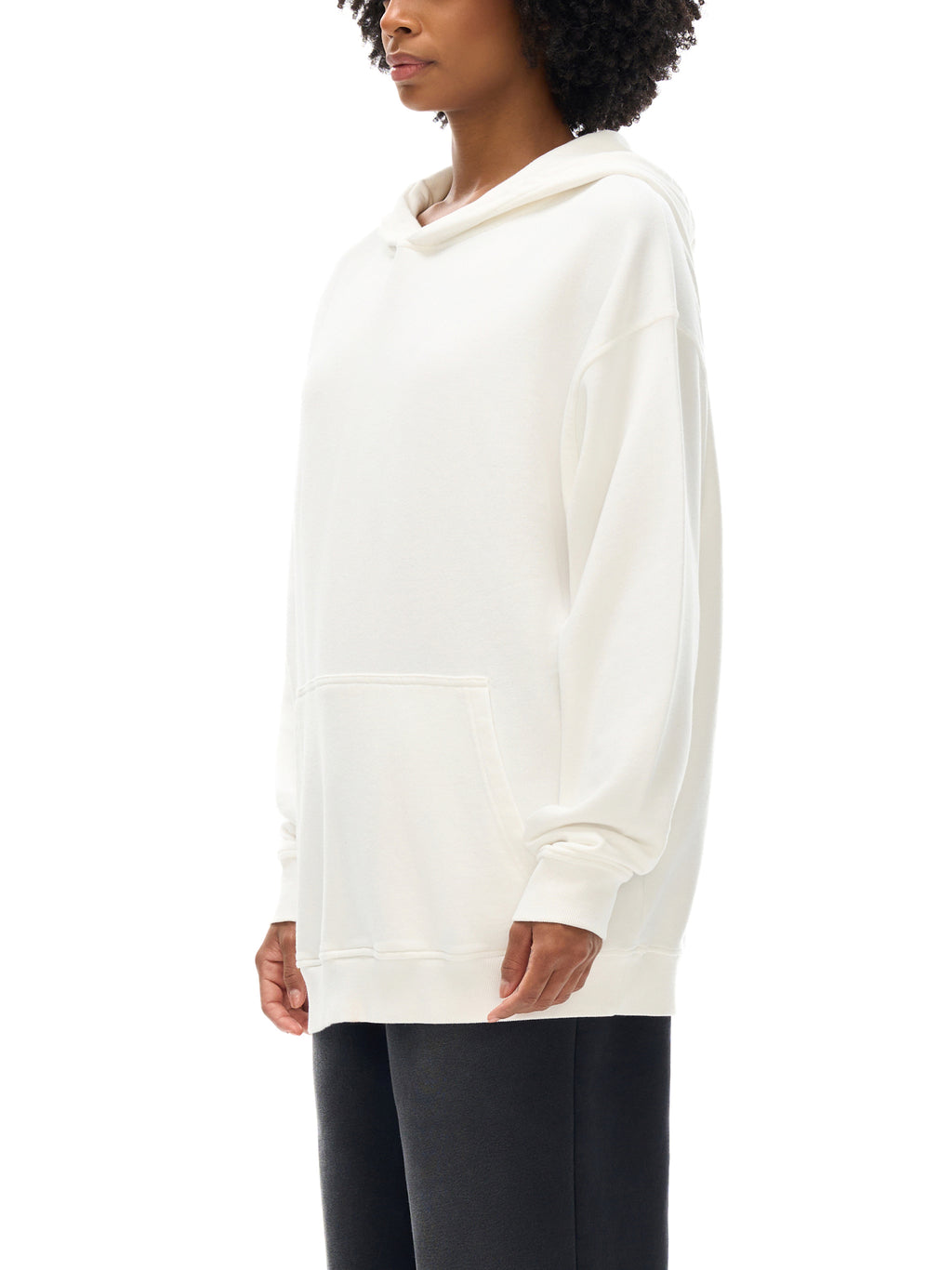 Person wearing a white hoodie on a white background