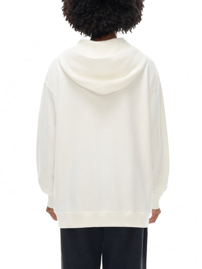 Person wearing a white hoodie from behind on a white background
