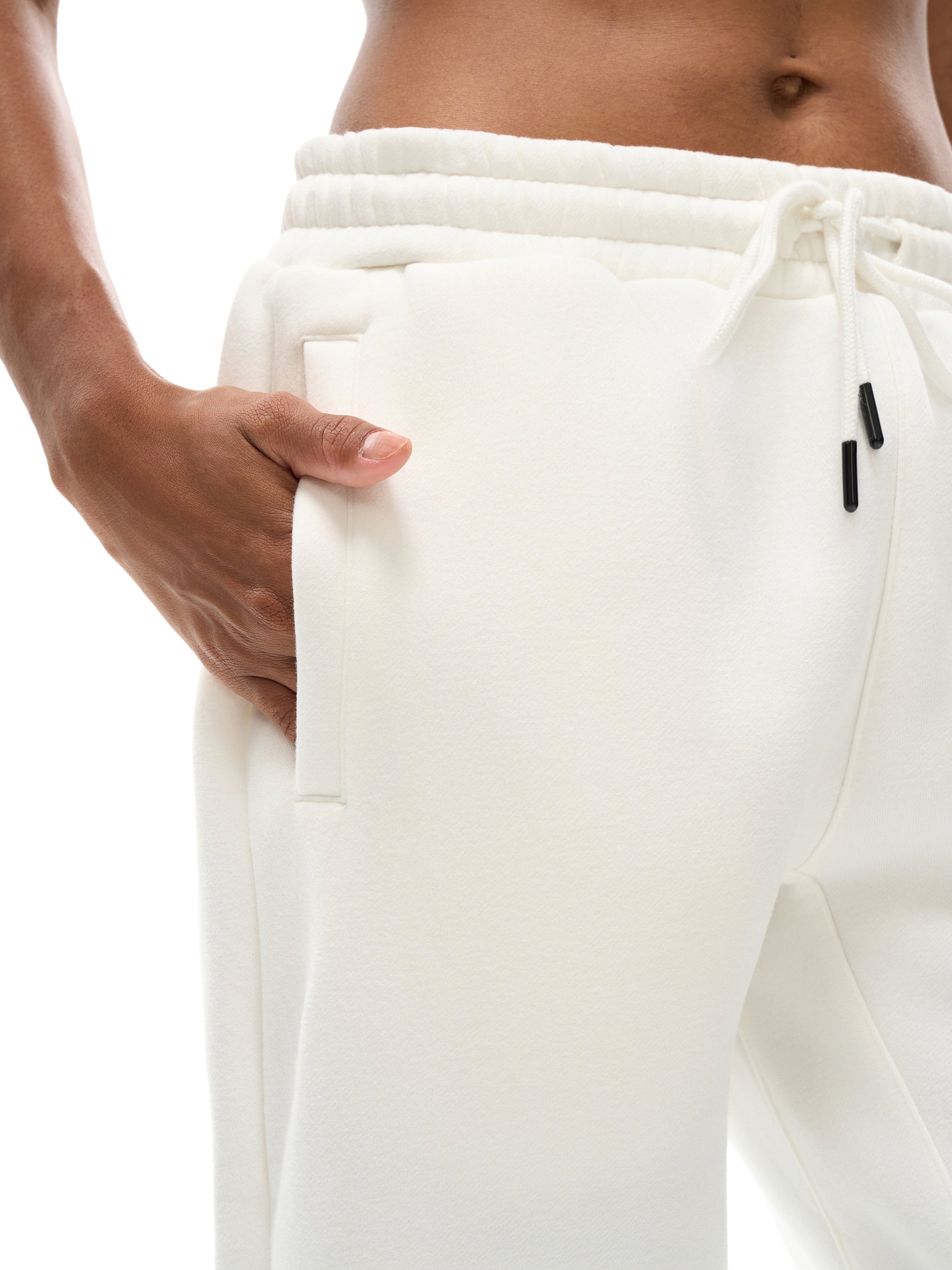 White sweatpants with drawstring waistband on a white background