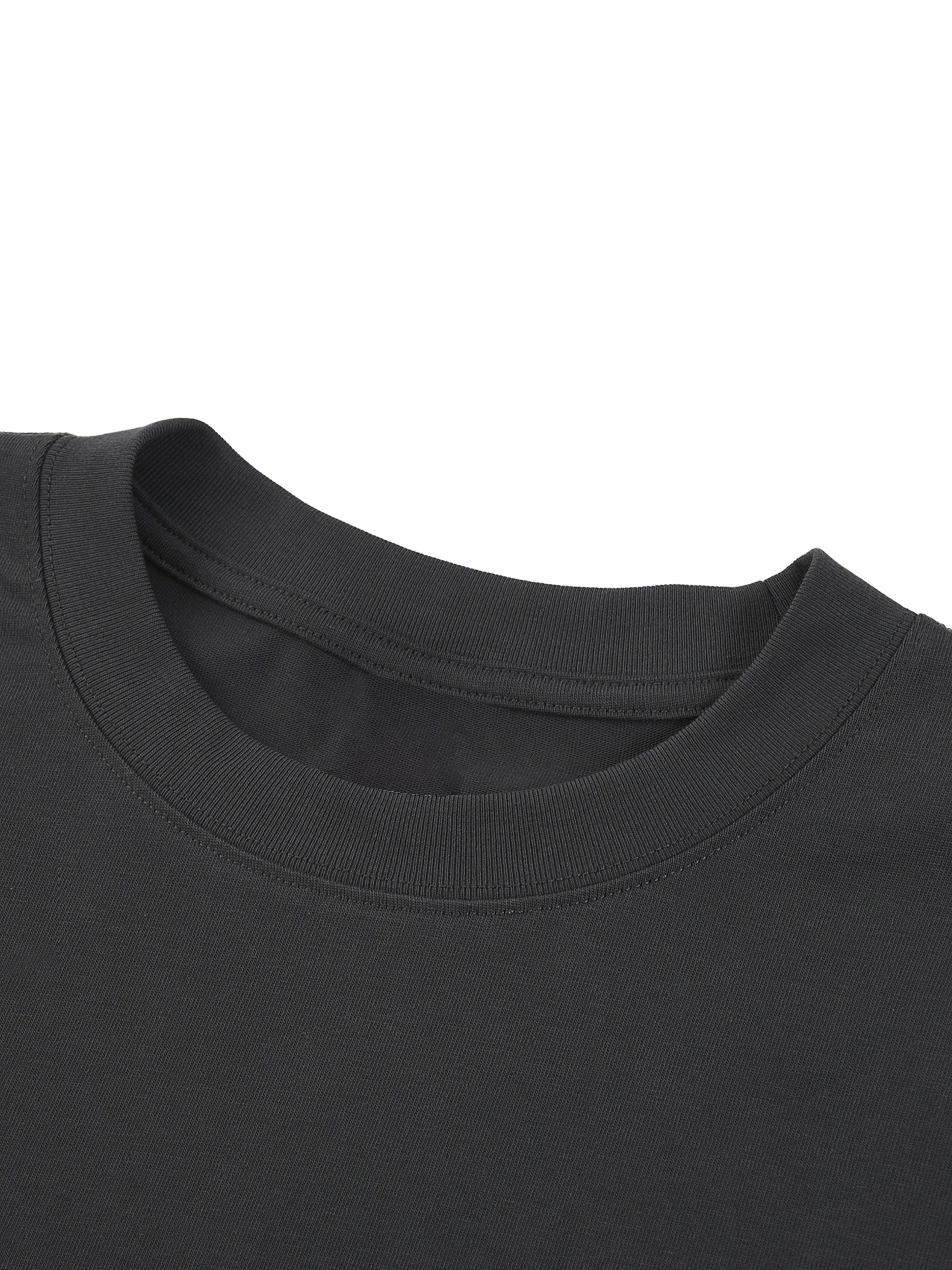 Close-up of a black t-shirt collar on a white background