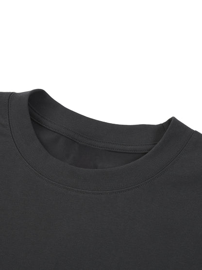 Close-up of a black t-shirt collar on a white background