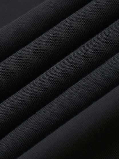 Close-up of black fabric with a textured pattern. 