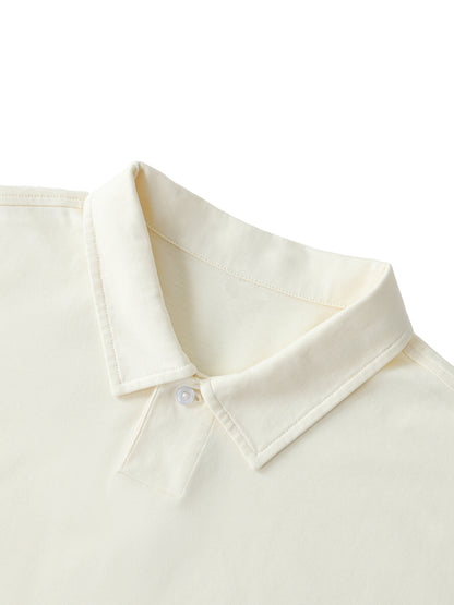 Close-up of VÉRON polo collar and premium fabric texture.