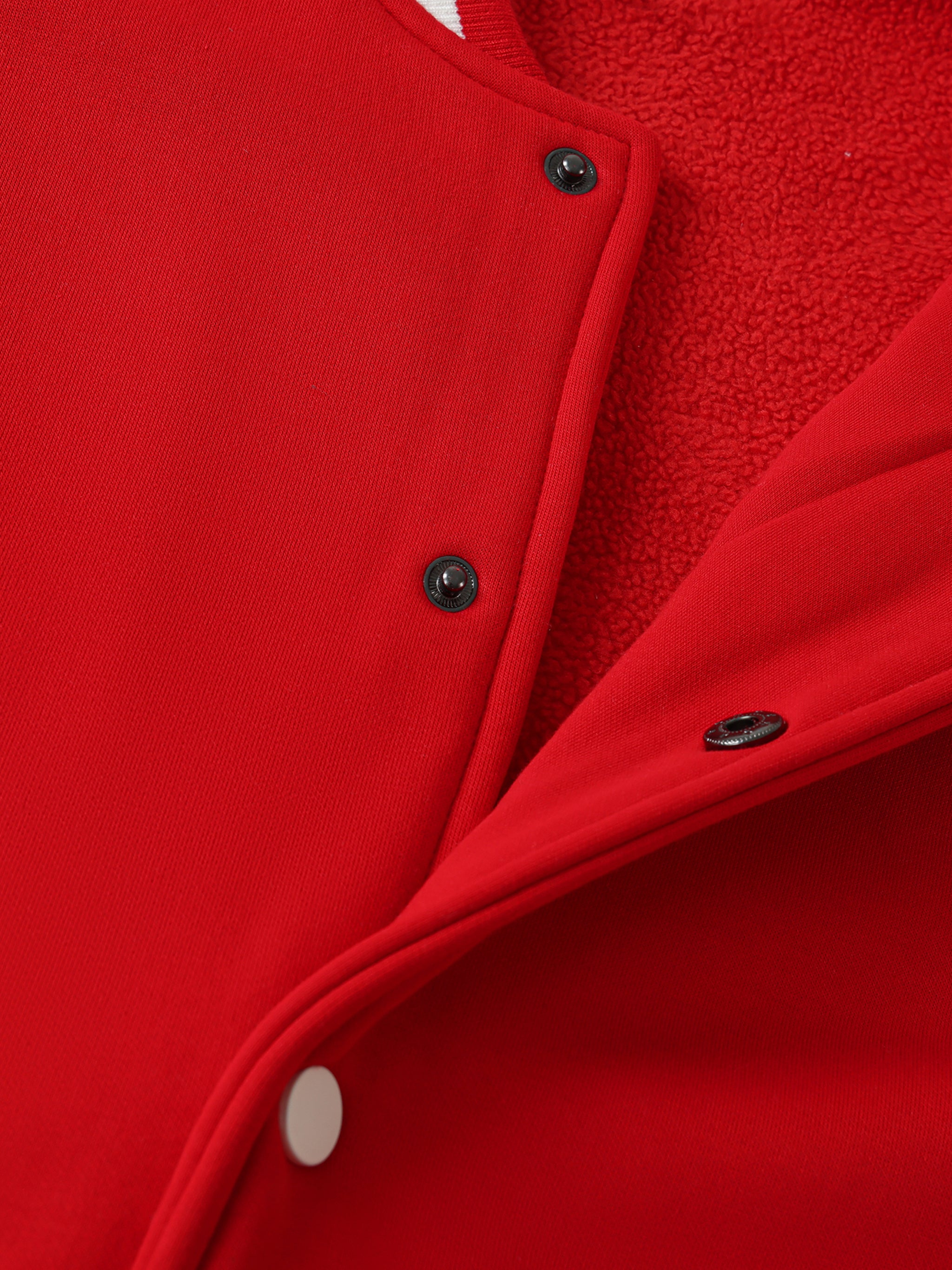 Close-up of embroidery on VÉRON Paradis Étoilé unisex varsity jacket 1