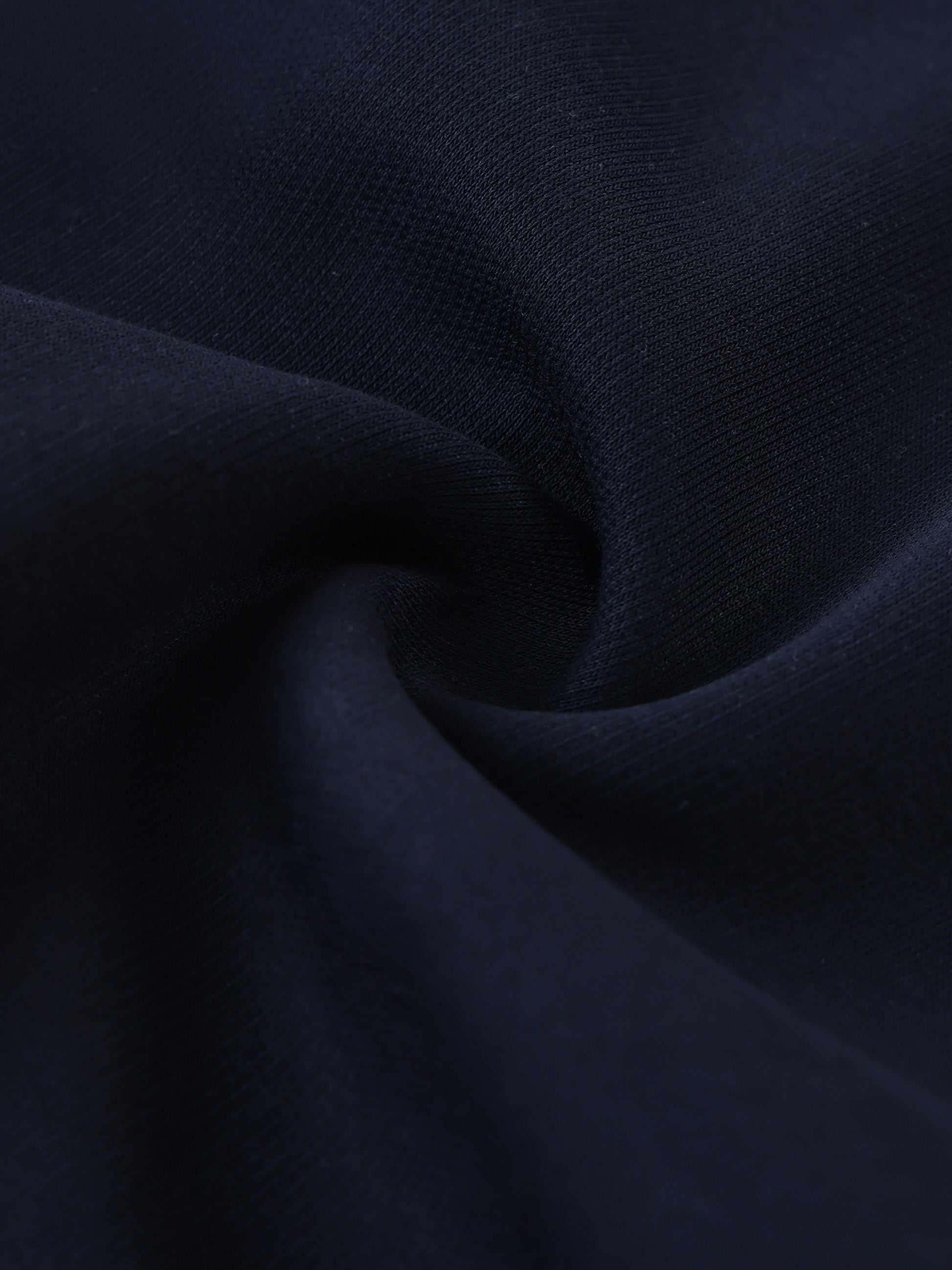 Close-up of dark blue fabric with a subtle texture