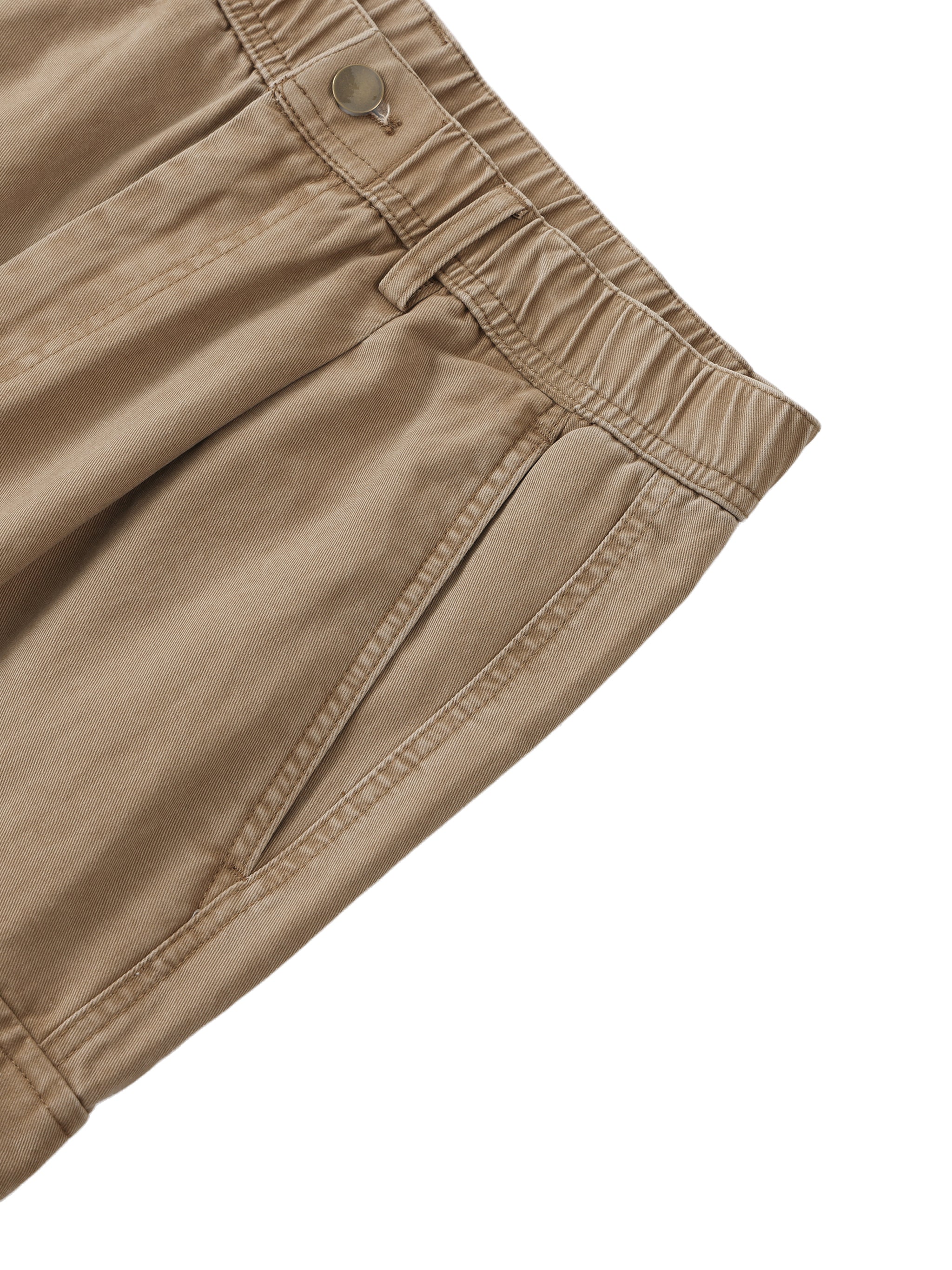 Close-up of beige pants on a white background