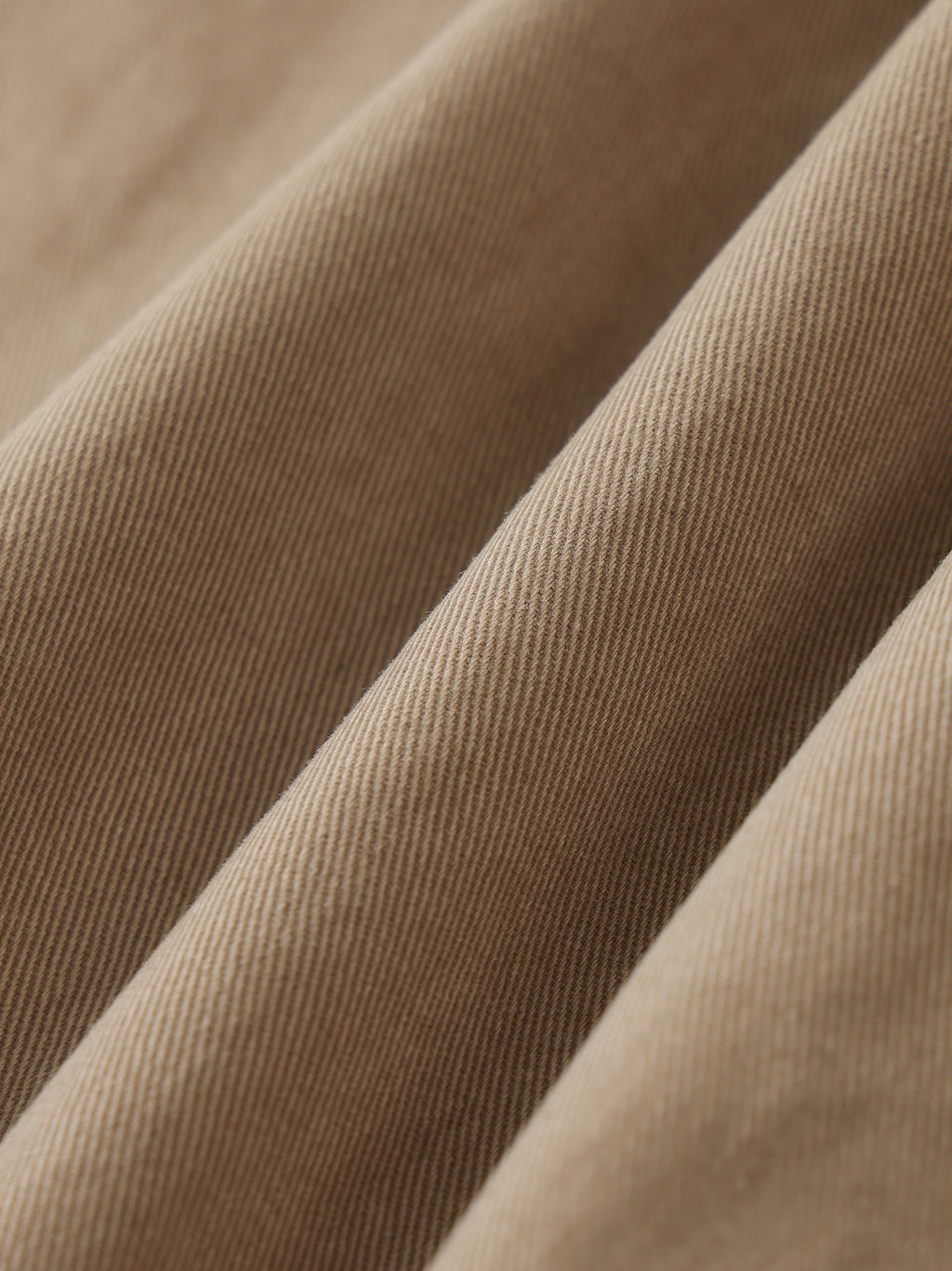 Close-up of brown fabric with a subtle texture