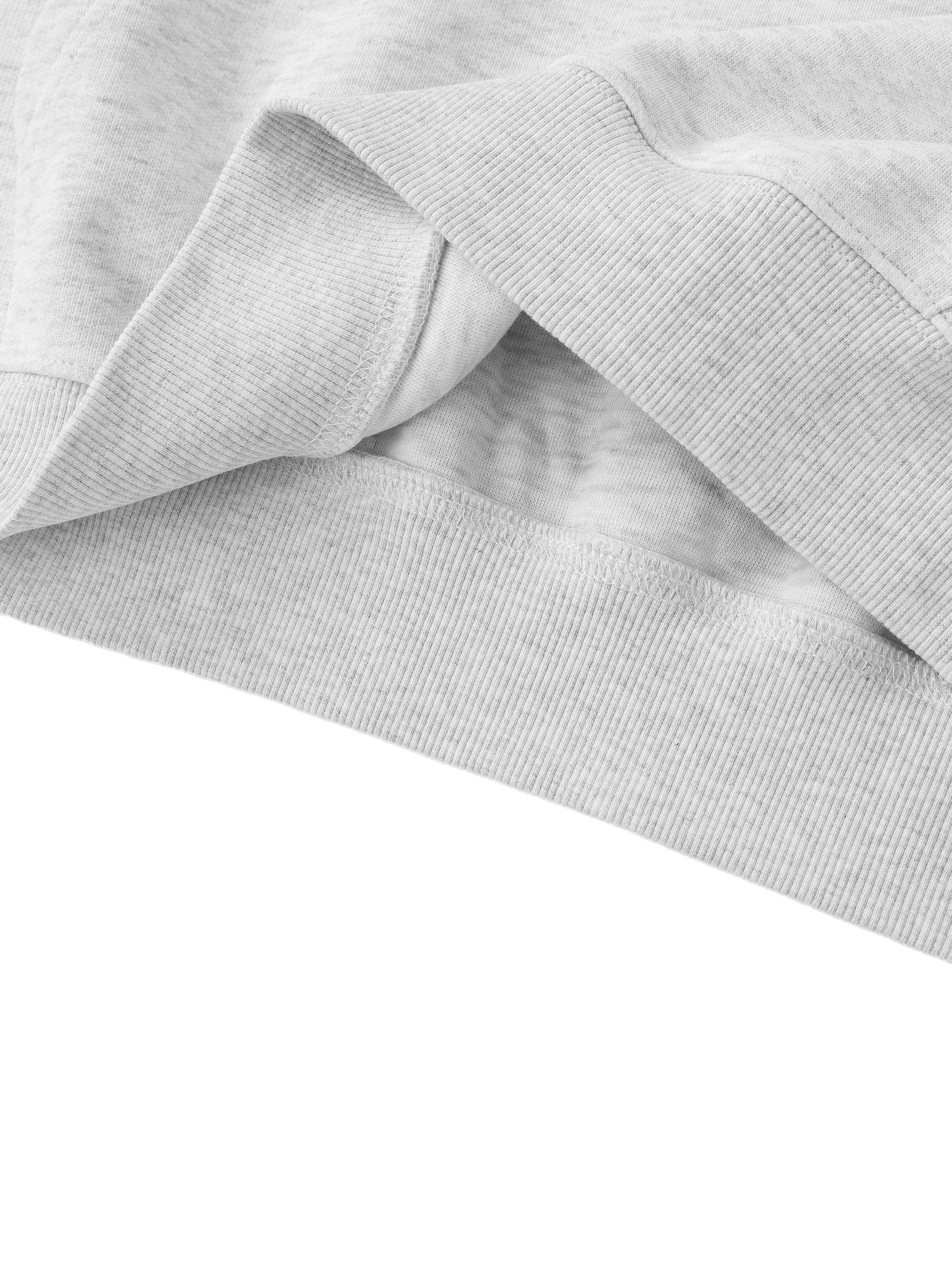 Close-up of gray fabric with a subtle pattern on a white background
